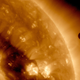 The transit of Venus (right) across the sun’s face in 2012, as seen in false color by the SDO satellite.